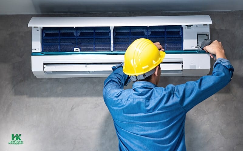 Professional Technician Performing Aircon Servicing