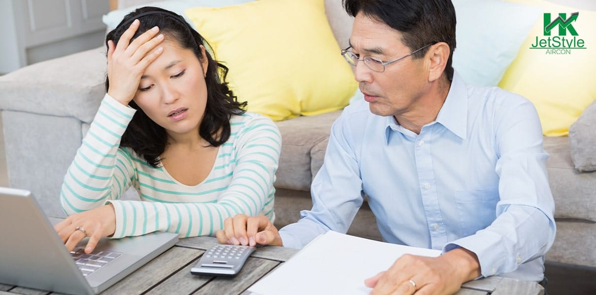 Couple Reacting From A Skyrocketed Electric Bill