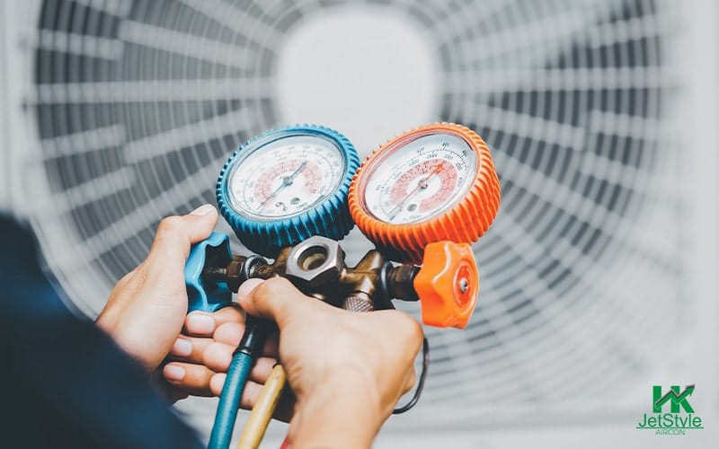 Holding a Manifold Gauge for the AC Unit