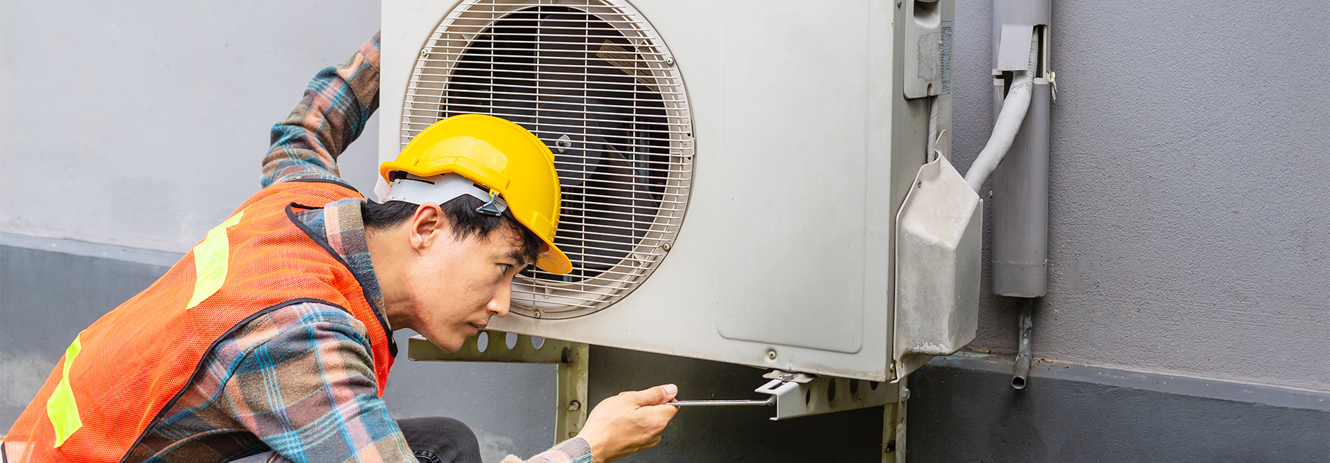 Image of a technician installing a brand-new aircon for a home